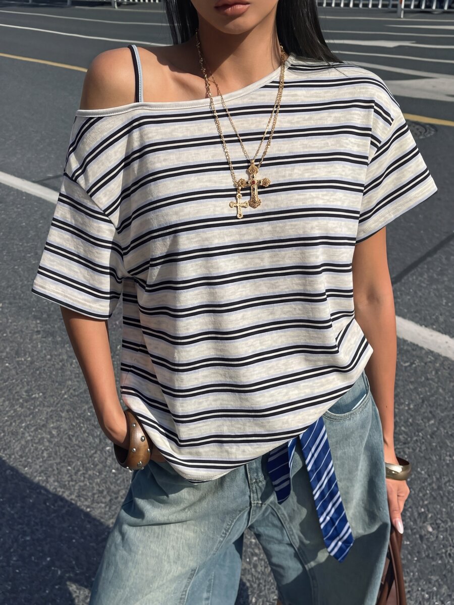 Women's casual loose fit cold shoulder cotton t-shirt with asymmetrical cutout neckline and short sleeves.