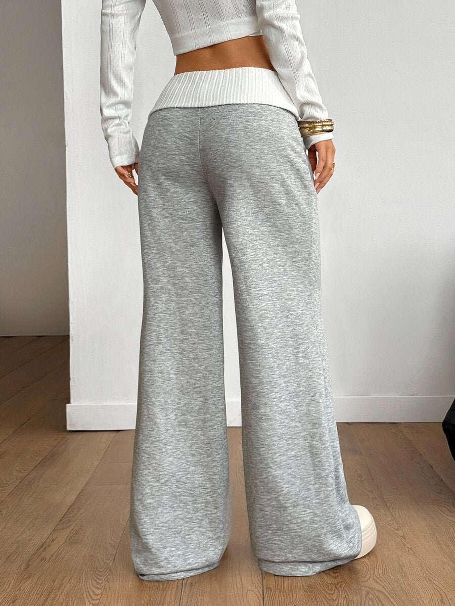 Women's wide leg flare lounge pants made of 95% cotton with a low elastic waistband and extra long hem.