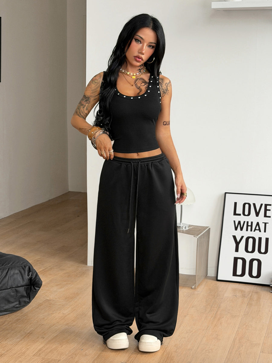 Women's loose fit wide leg graphic sweatpants in light grey with an elastic drawstring waistband