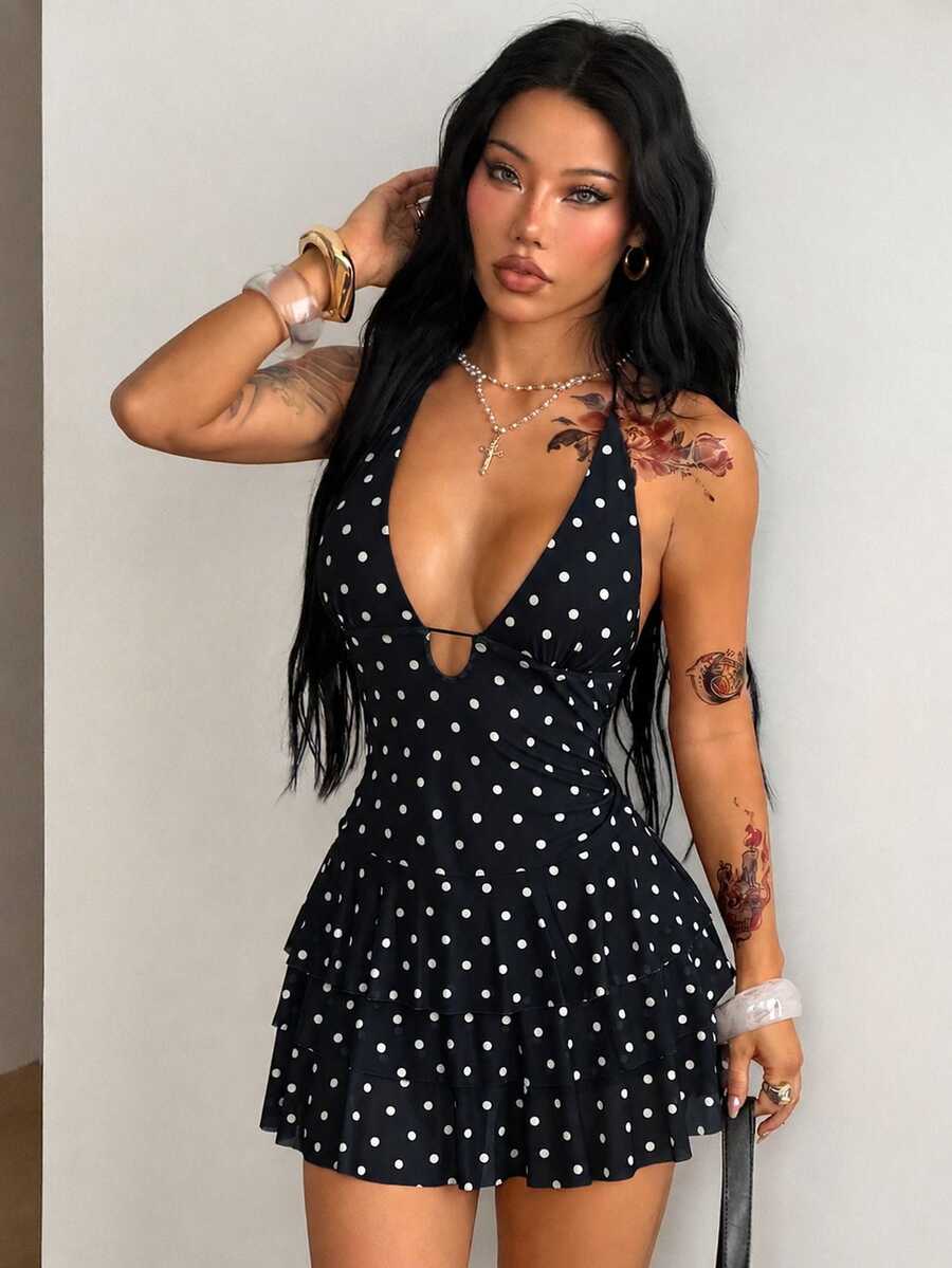 Front view of a women's lace halter mini dress featuring a slim-fit bodice, flared hem, and sleeveless design.