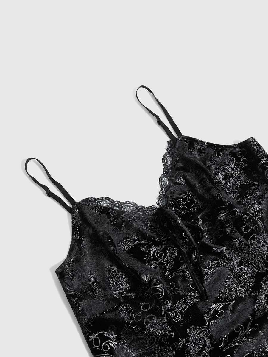 Plus size velvet slip dress featuring delicate contrast lace trim, spaghetti straps, and flared mini skirt with matching arm sleeves.