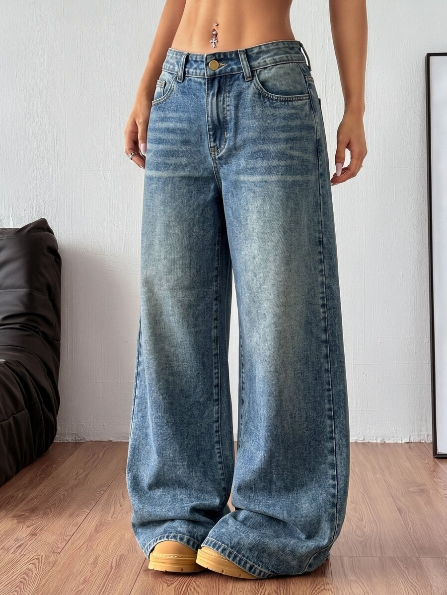 Women's relaxed fit wide leg denim jeans with pockets and a zipper fly.