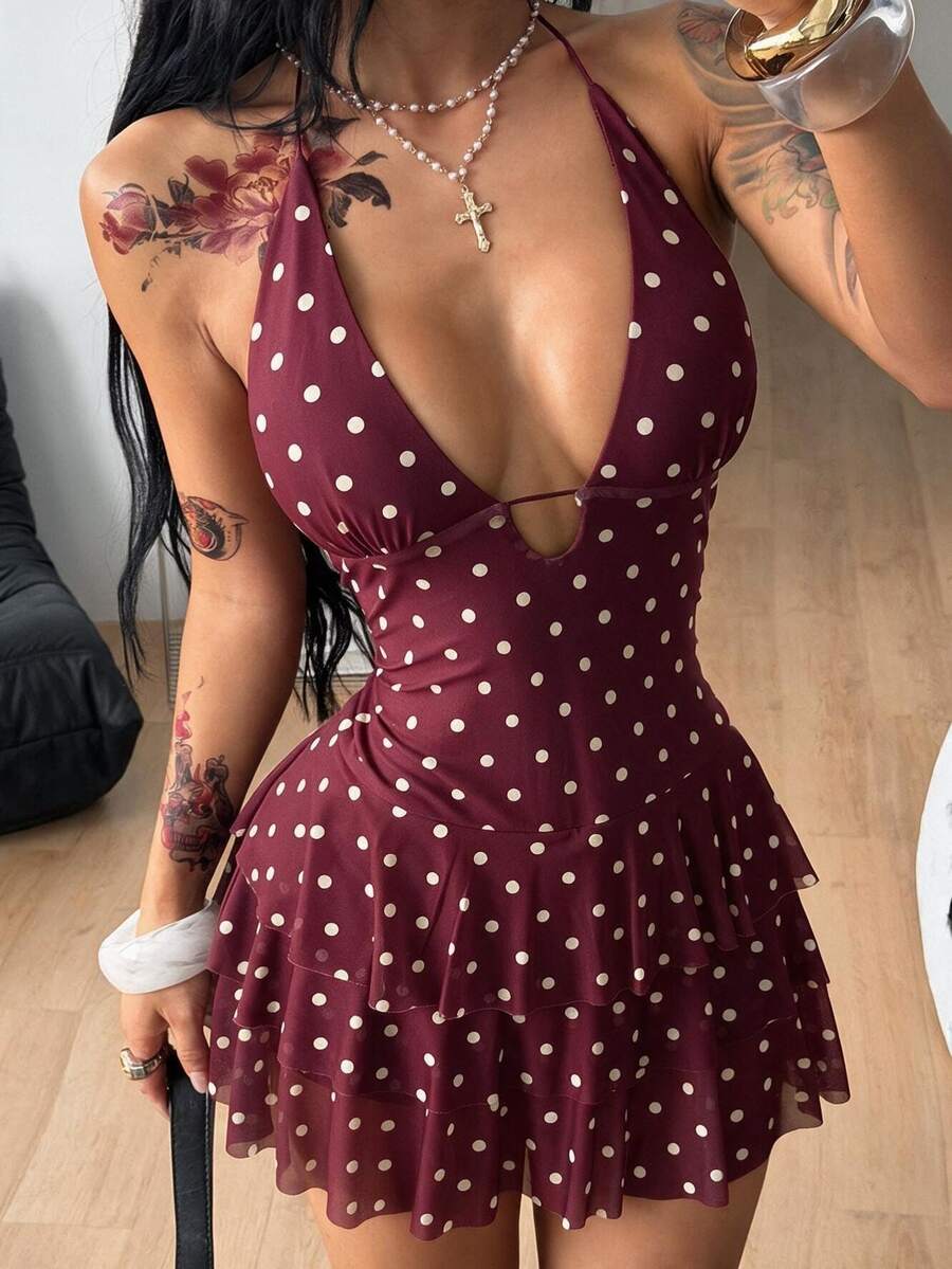 Front view of a women's lace halter mini dress featuring a slim-fit bodice, flared hem, and sleeveless design.