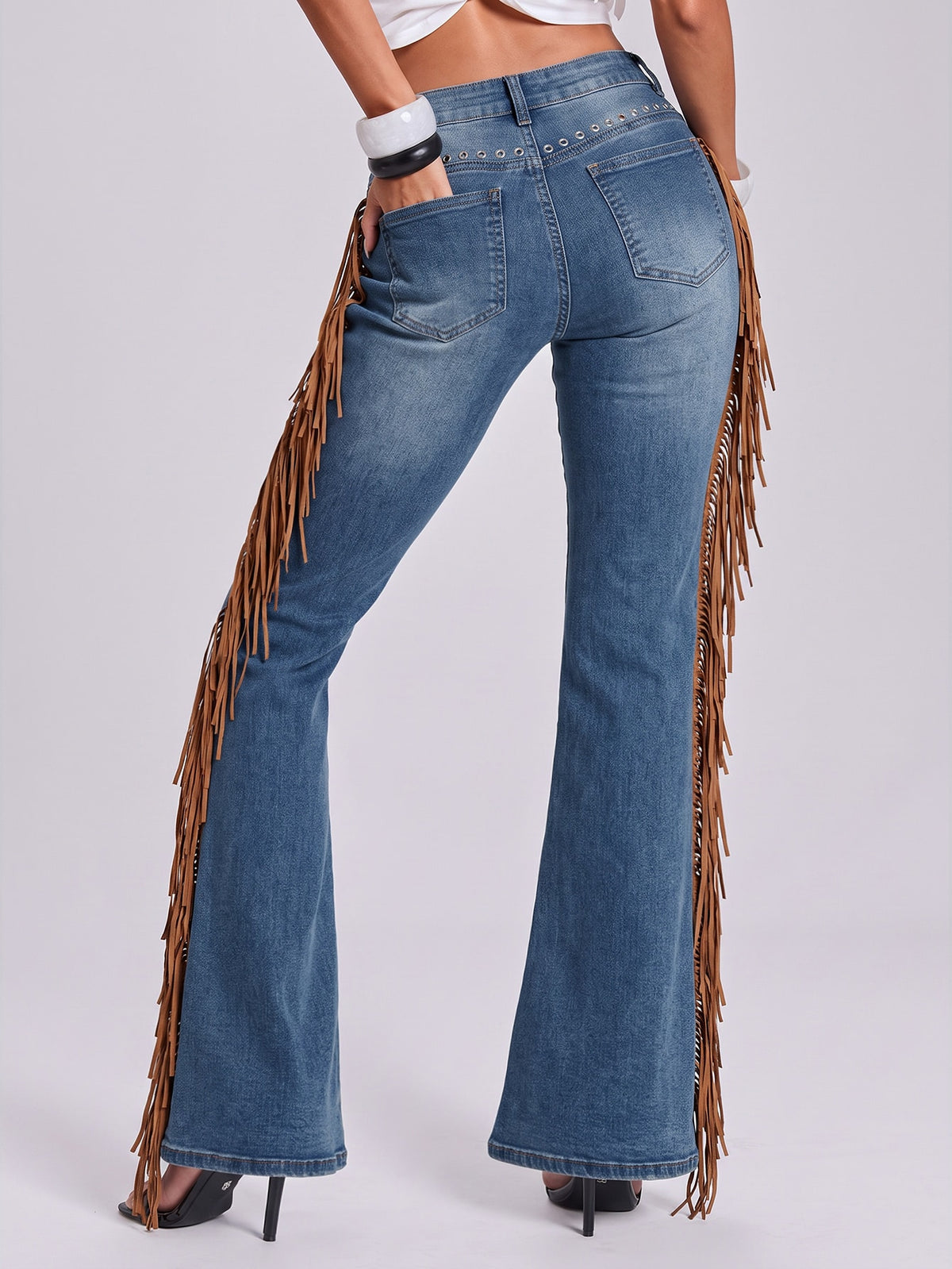 Women's ultra low waist flare jeans in washed stretch denim featuring an extra long bootcut leg and zipper fly closure.