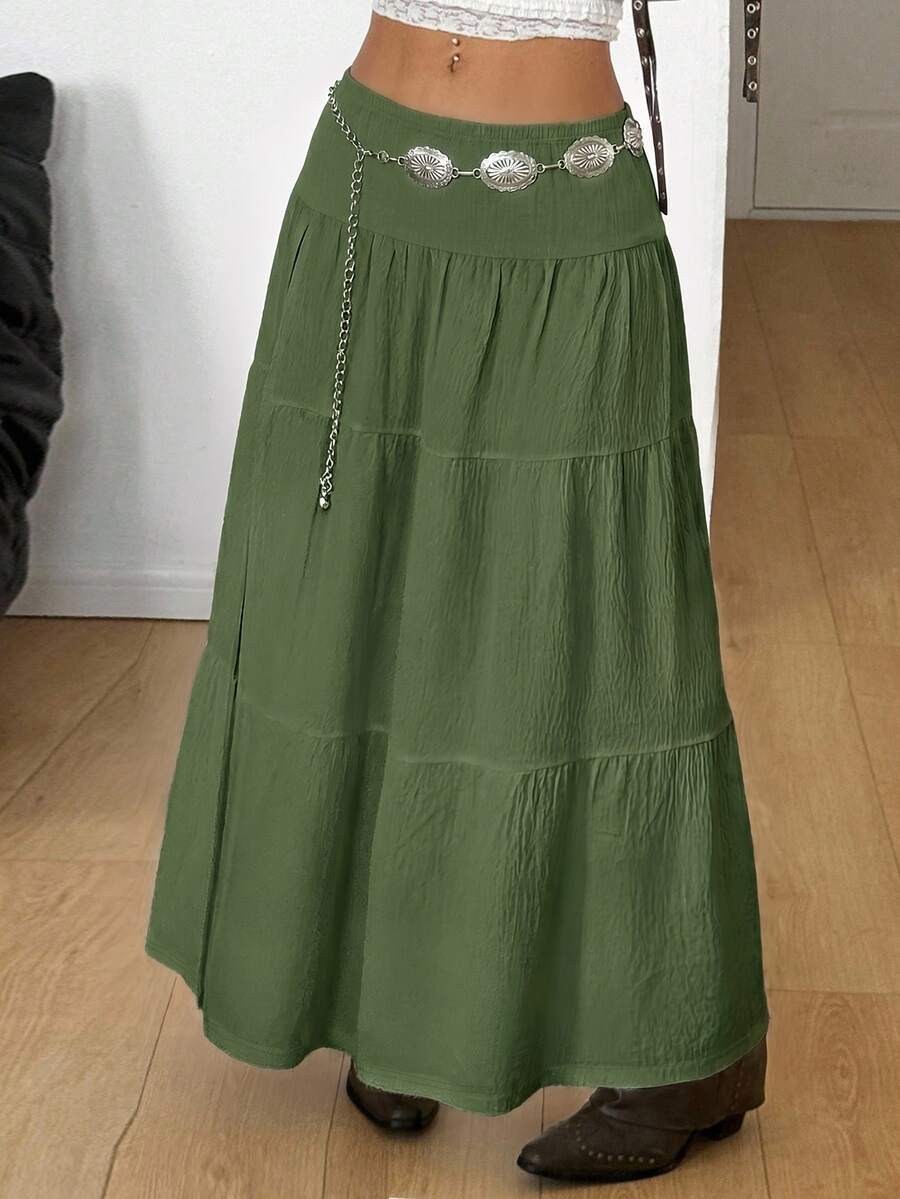 Women's red plaid long skirt featuring a low-rise waist and a side slit in lightweight woven fabric.