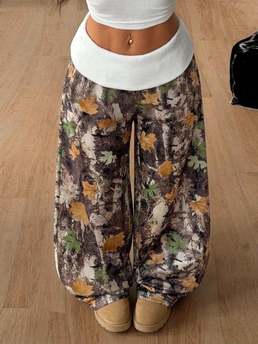 Women's wide leg trousers with a tree branch graphic pattern, loose fit, and mid-rise waist in woven fabric.