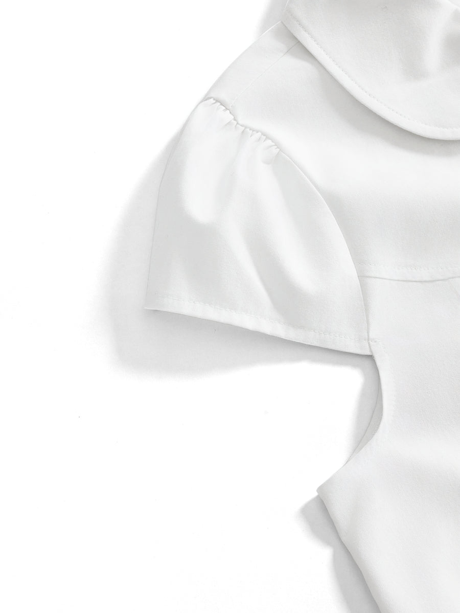 Women's short puff sleeve cotton blouse featuring a Peter Pan collar, double button detail, and front pocket.