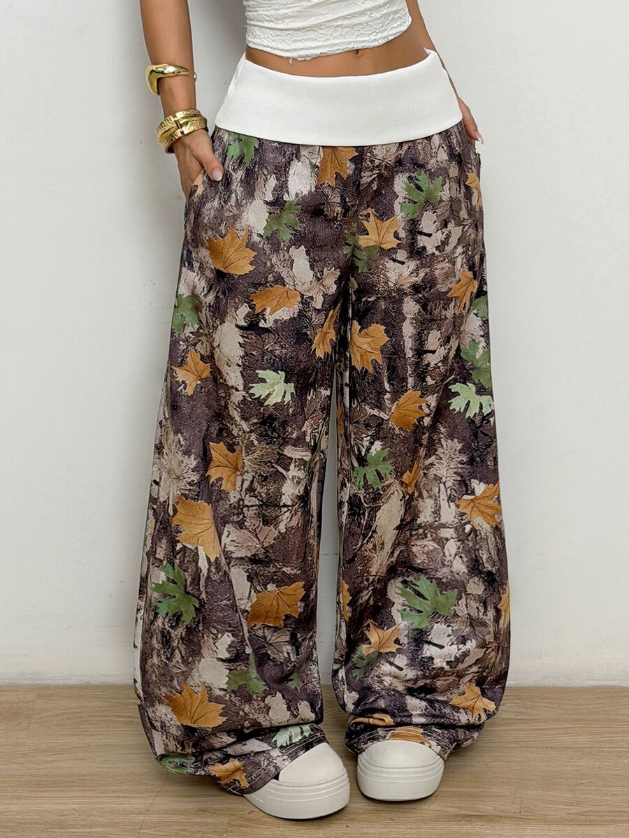 Women's wide leg trousers with a tree branch graphic pattern, loose fit, and mid-rise waist in woven fabric.