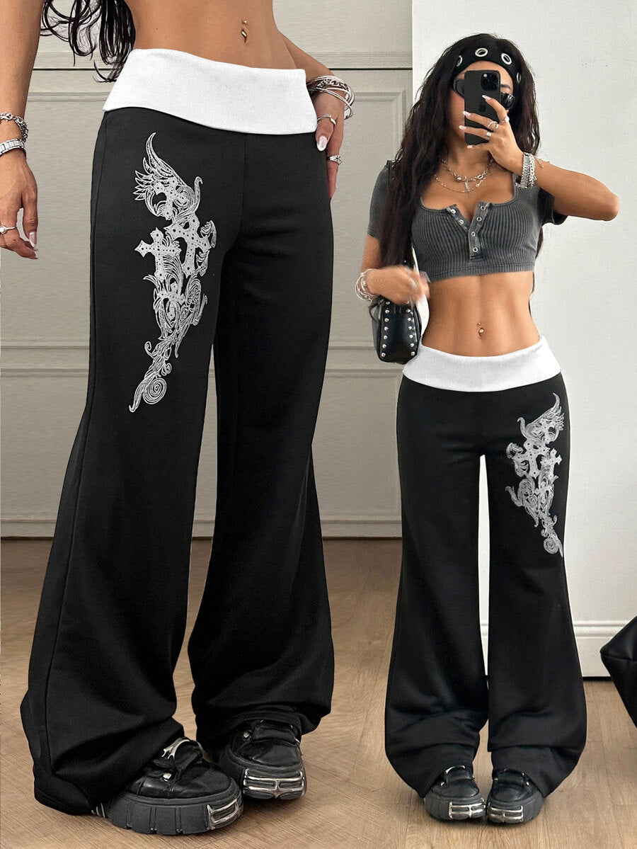 Women's black low waist wide leg flare sweatpants with rib-knit texture and contrast binding details.