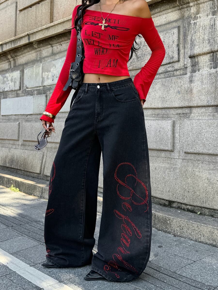 Front view of women's loose wide leg denim jeans featuring a mid waist, classic front pockets, and a zipper fly closure.