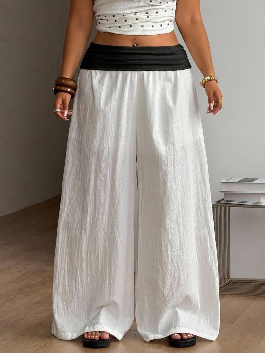 Women's plus size wide leg cotton pants featuring a relaxed loose fit and high waist design.