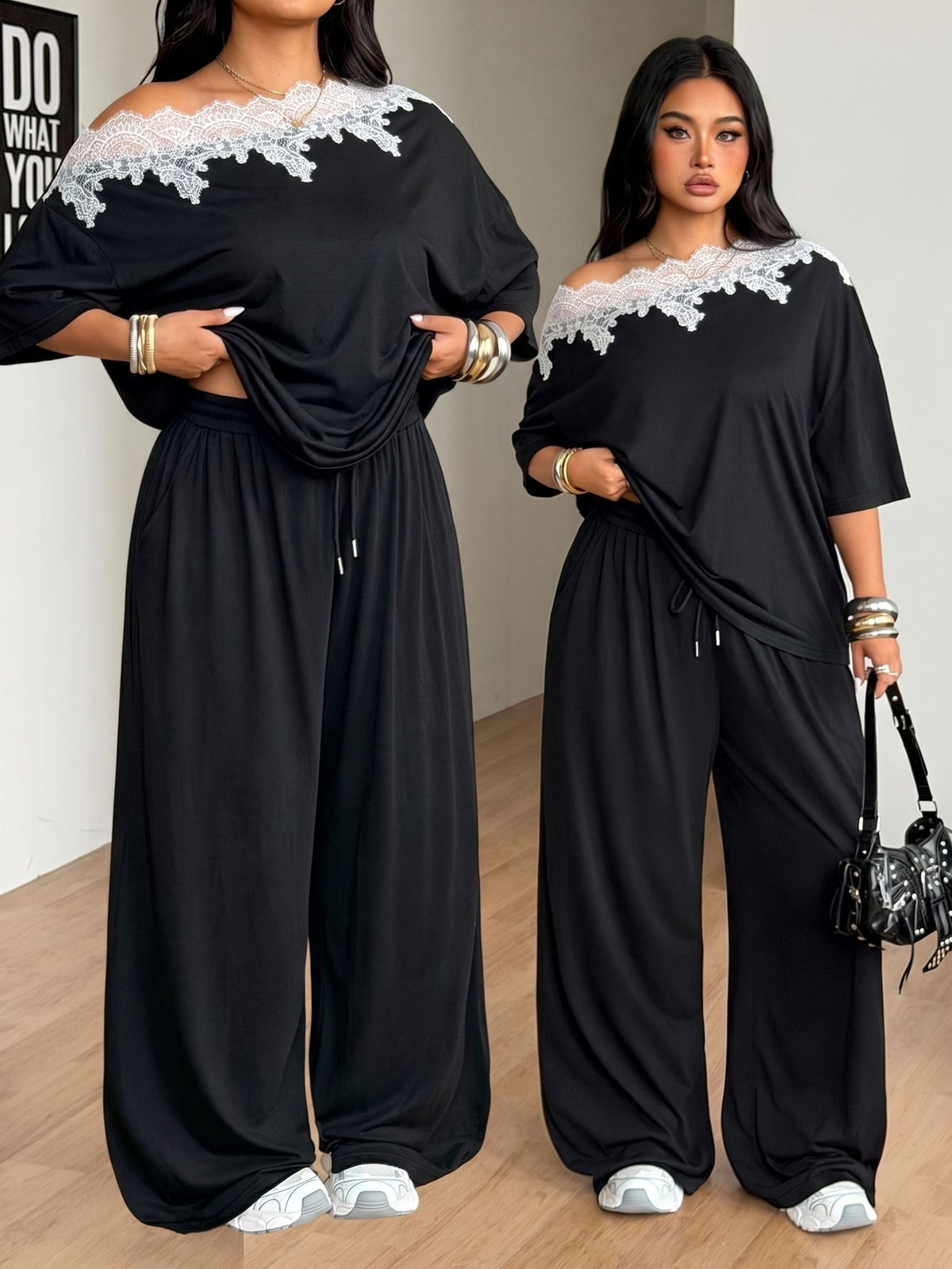 Women's casual two-piece outfit featuring a loose short-sleeve asymmetrical neck t-shirt and matching long wide leg pants with pockets.