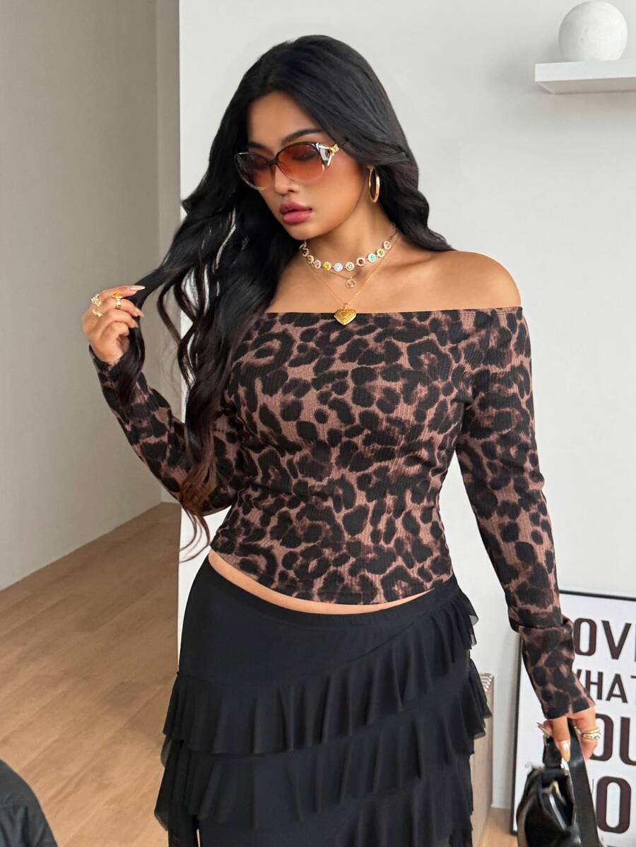 Women's striped off the shoulder long-sleeve top with contrast lace trim and ribbed knit texture.