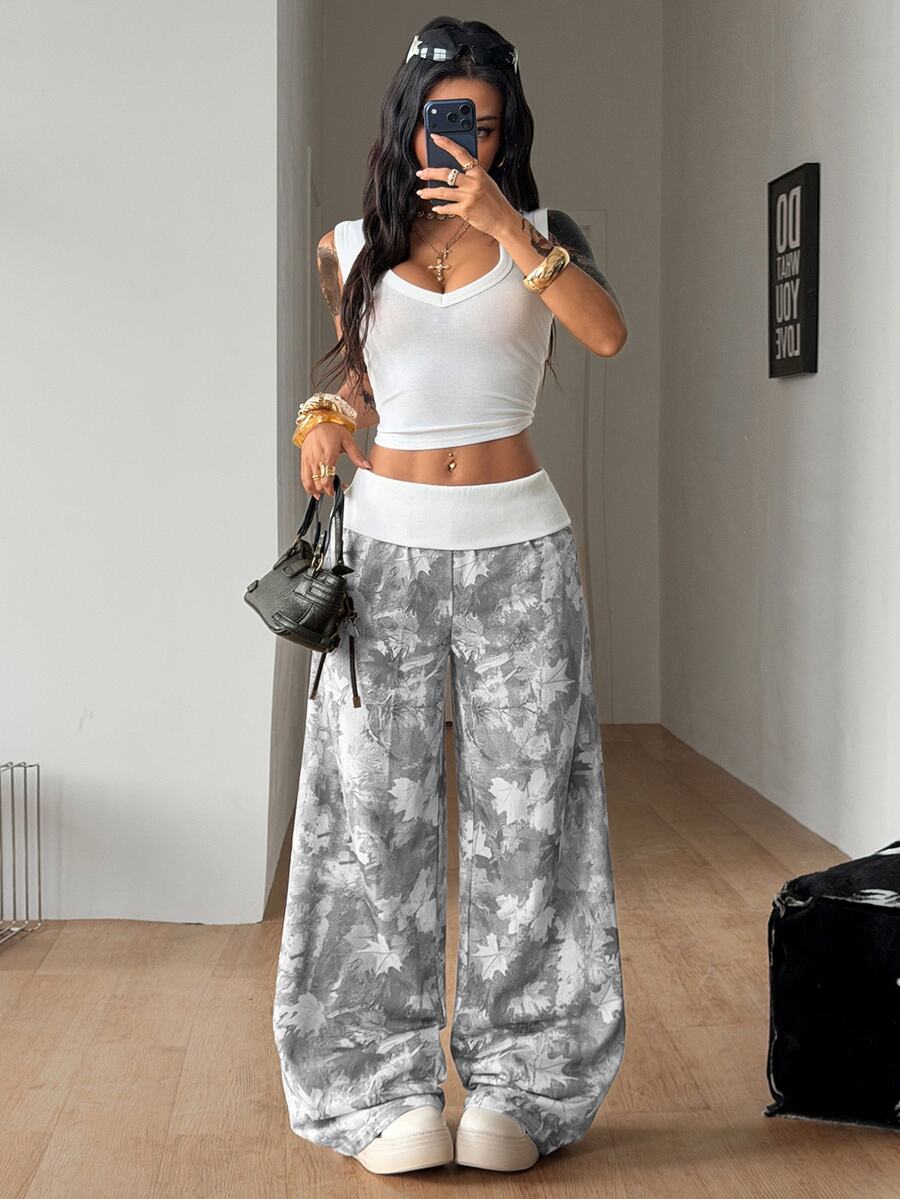 Women's wide leg trousers with a tree branch graphic pattern, loose fit, and mid-rise waist in woven fabric.