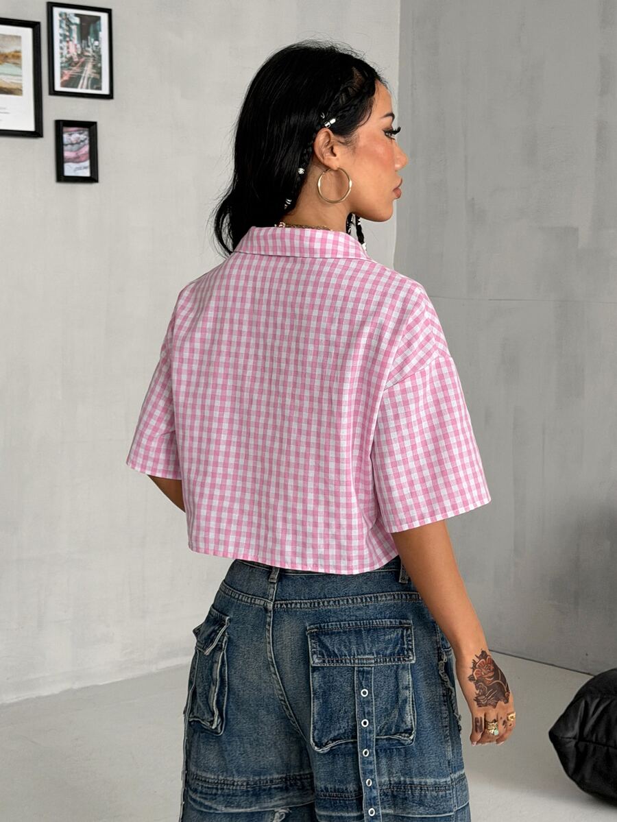 Women's plaid crop shirt with button front, chest pocket, short sleeves, and loose casual fit.
