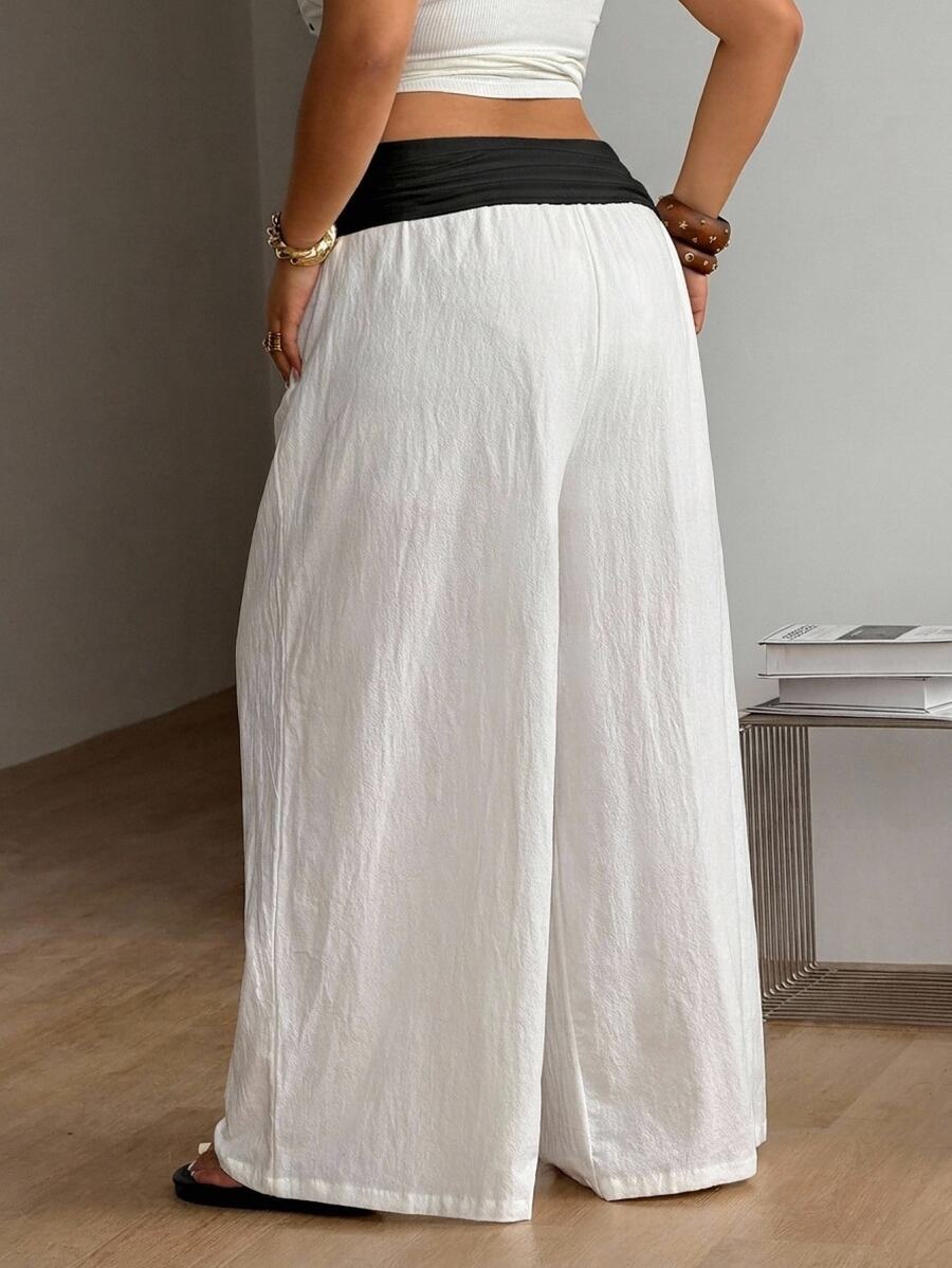 Women's plus size wide leg cotton pants featuring a relaxed loose fit and high waist design.