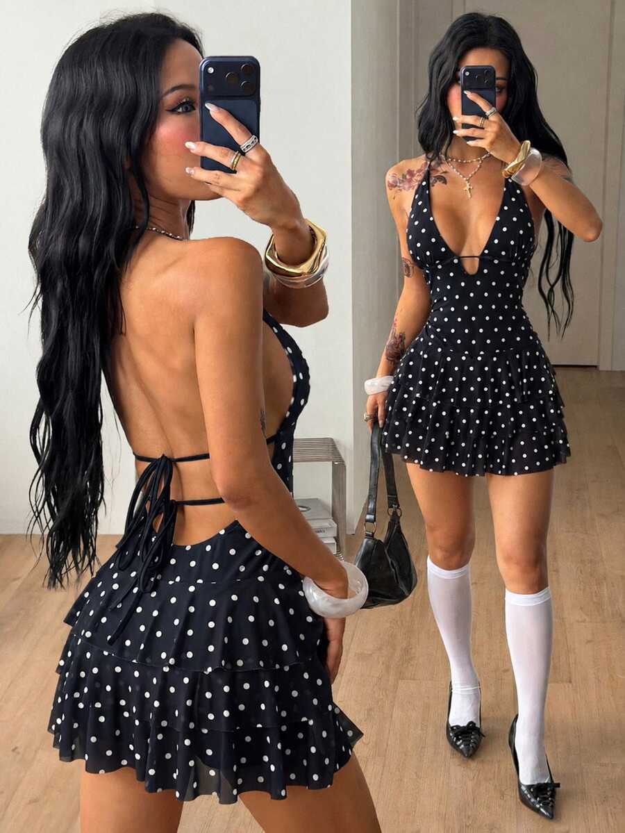 Front view of a women's lace halter mini dress featuring a slim-fit bodice, flared hem, and sleeveless design.