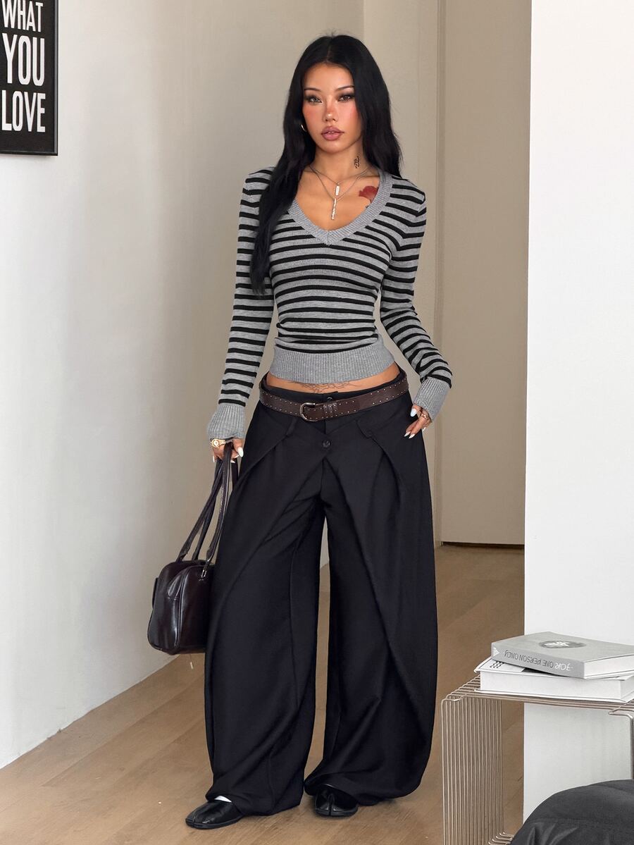 Women's slim fit cable-knit sweater with a V-neckline and long sleeves in solid green rib knit fabric.