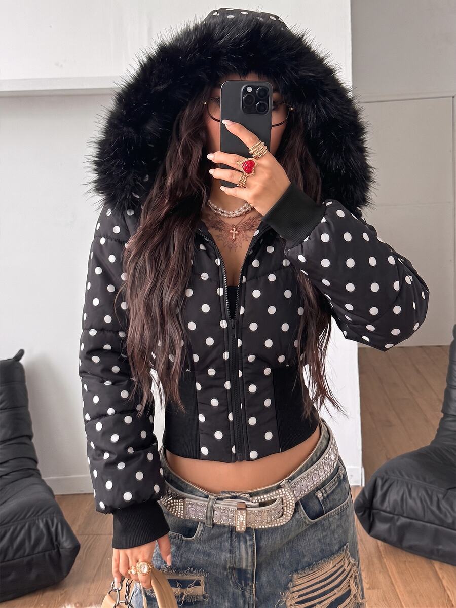 Women's brown cropped puffer jacket featuring a faux fur trimmed hood, front zipper, and ribbed hem.