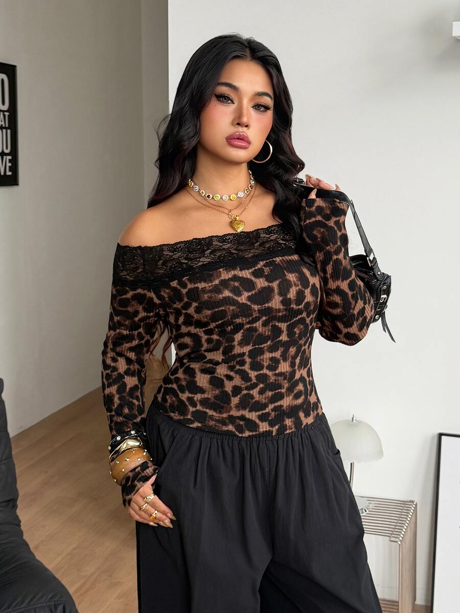 Women's striped off the shoulder long-sleeve top with contrast lace trim and ribbed knit texture.