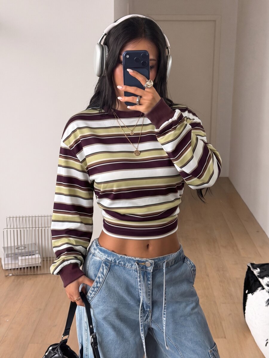 Women's striped pullover sweatshirt featuring drop shoulder long sleeves and a classic round neckline.