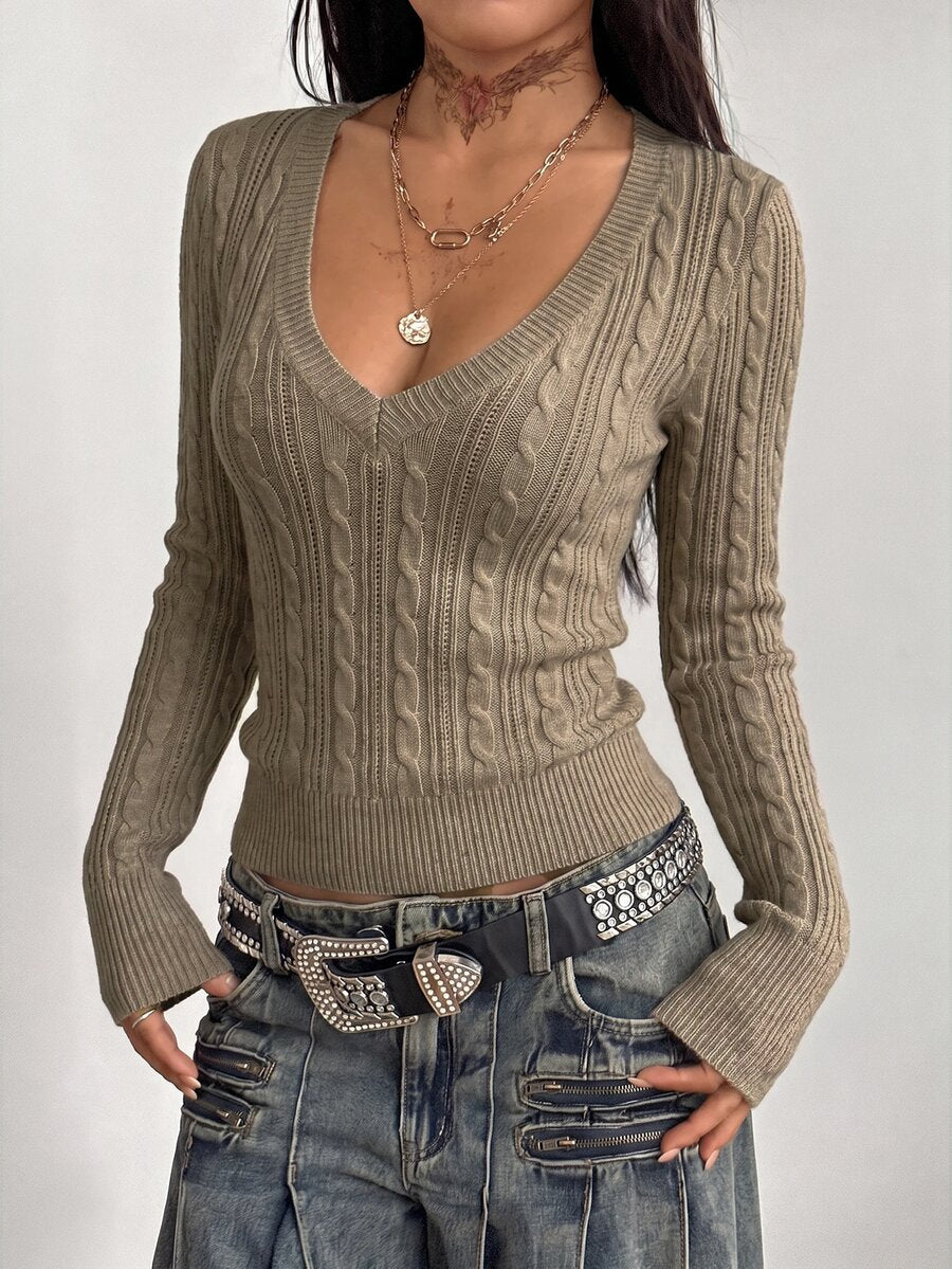 Women's slim fit cable-knit sweater with a V-neckline and long sleeves in solid green rib knit fabric.