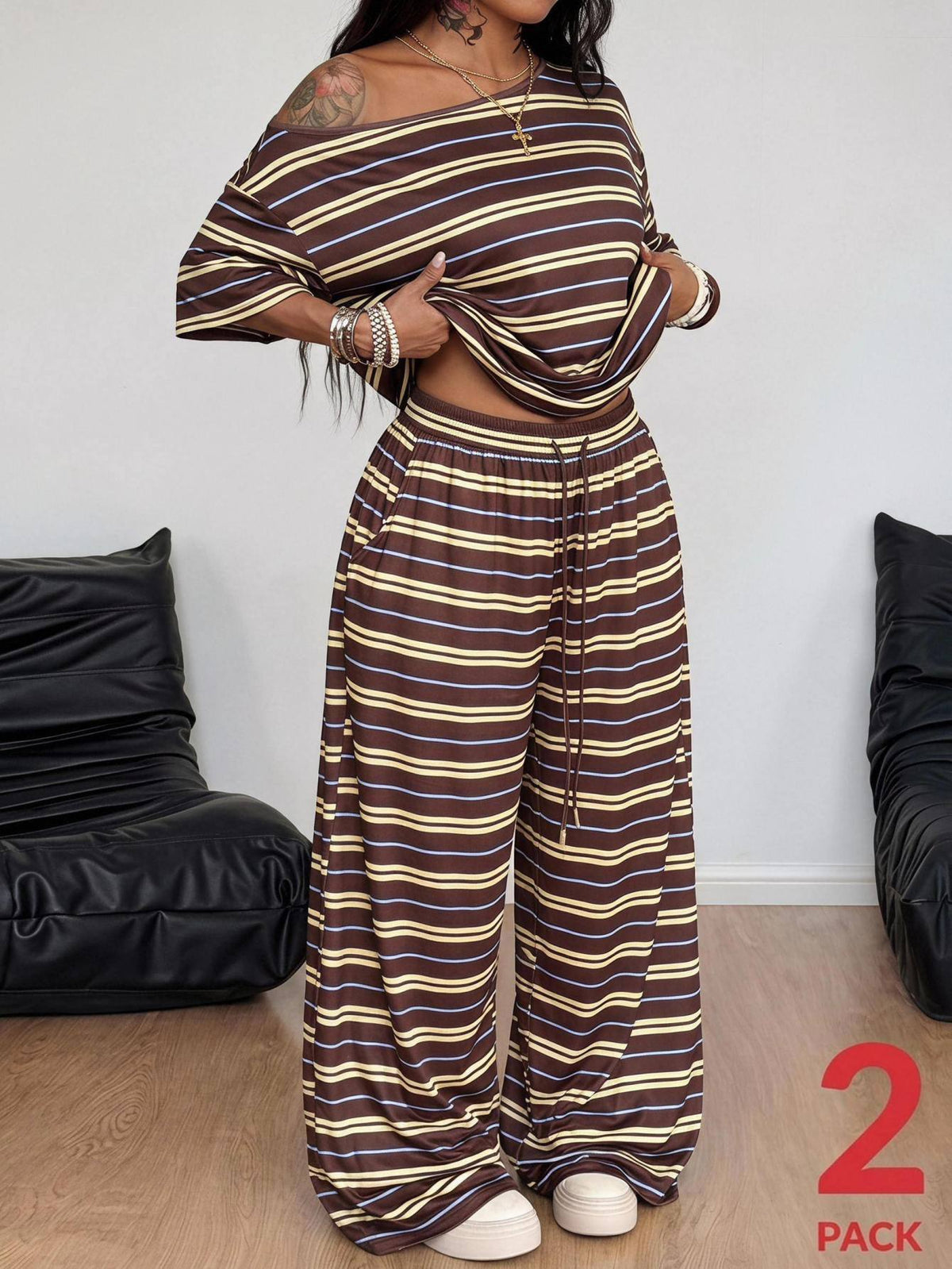 Women's two-piece lounge set featuring a loose drop shoulder asymmetrical neck short sleeve t-shirt and wide-leg knit pants with pockets.