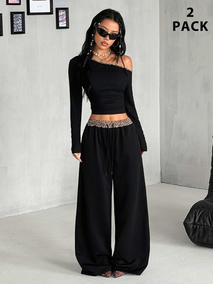 Women's two-piece striped knit tracksuit set featuring a brown asymmetrical neckline long sleeve crop top and matching high-waisted wide leg sweatpants.