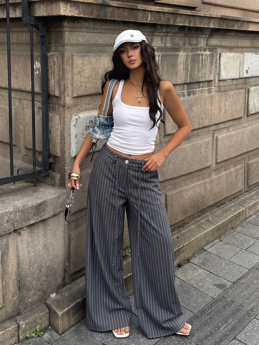 Women's casual straight leg striped woven pants featuring a low waist and zipper fly closure.