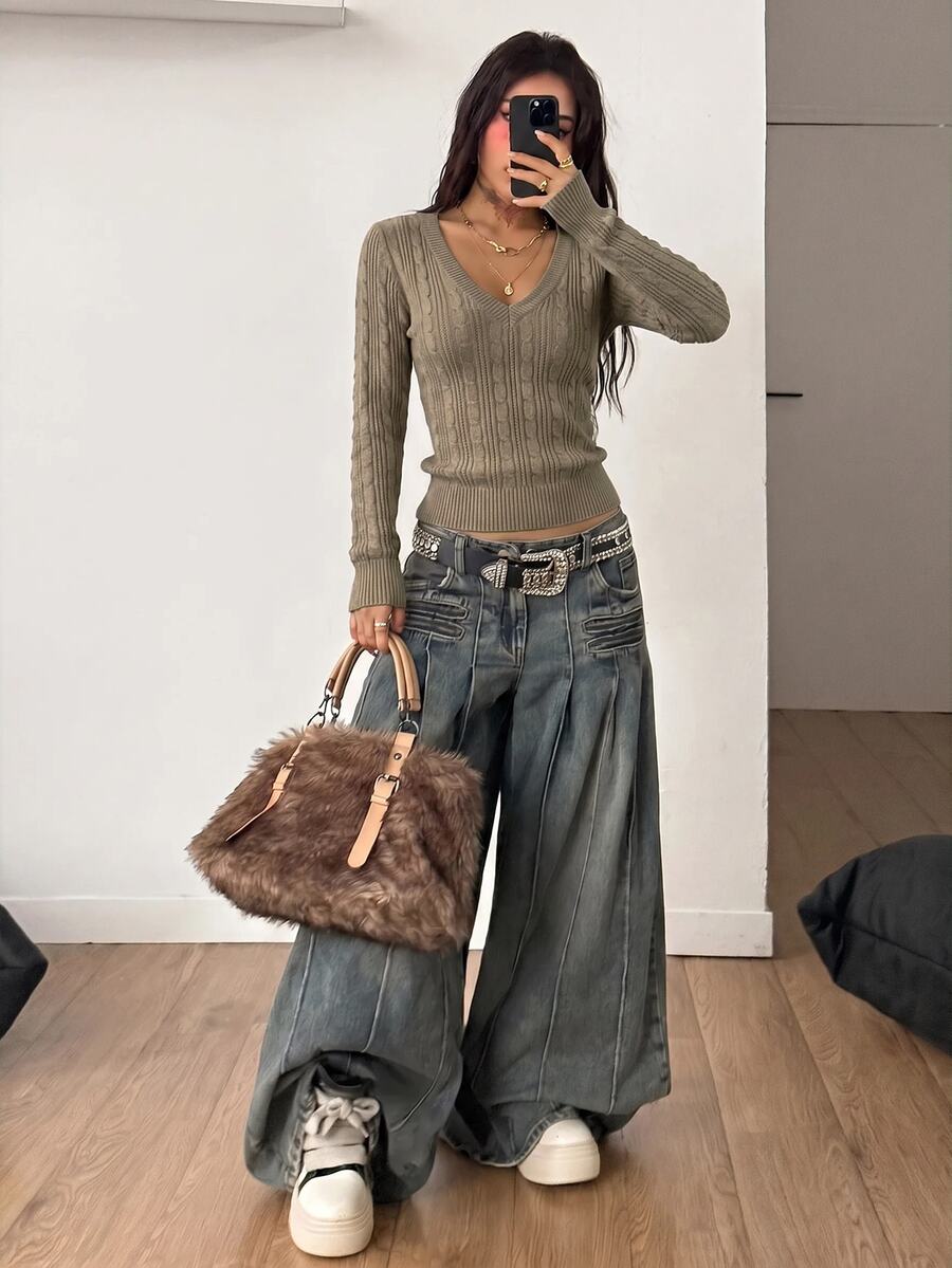 Women's slim fit cable-knit sweater with a V-neckline and long sleeves in solid green rib knit fabric.