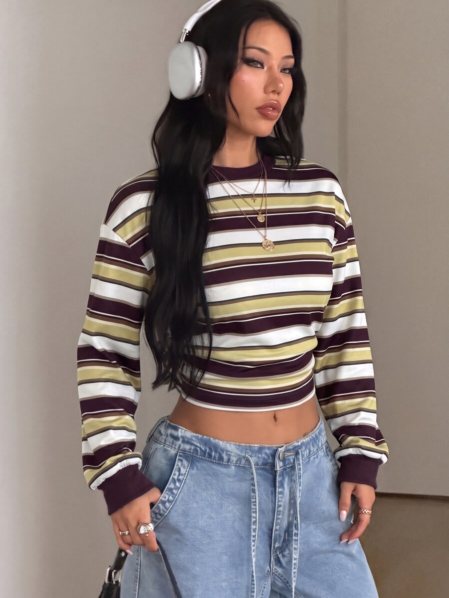 Women's striped pullover sweatshirt featuring drop shoulder long sleeves and a classic round neckline.