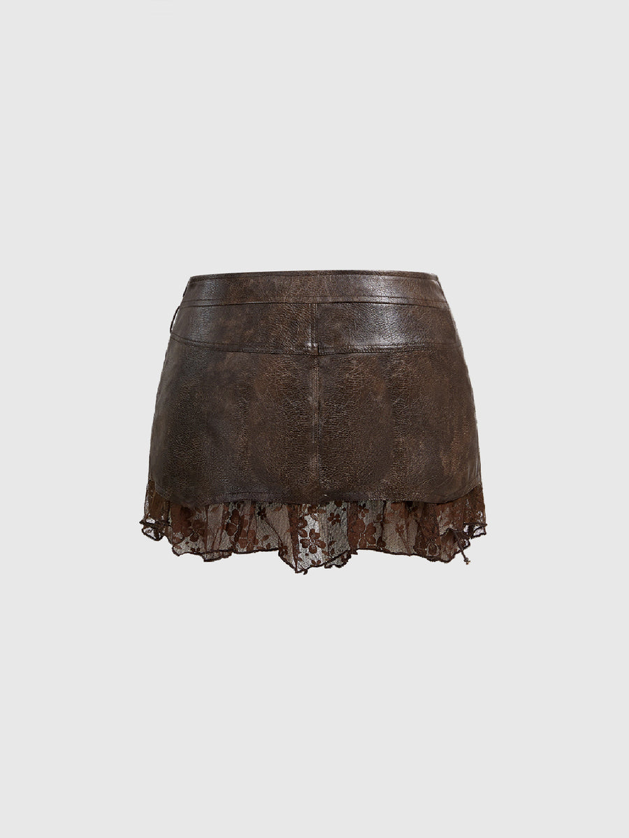Women's washed PU leather mini skirt with contrast lace trim, wrap knot tie detail, and asymmetrical hem.