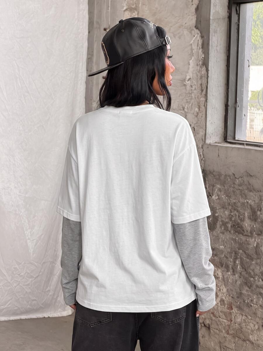 Women's casual graphic long sleeve t-shirt with a round neck, drop shoulder sleeves, and loose relaxed fit.