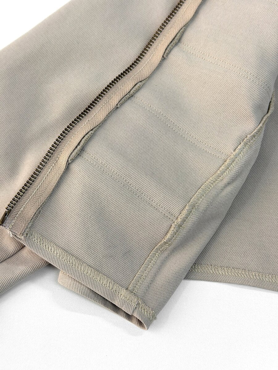 Front view of a women's black cropped PU leather jacket featuring a stand collar, long sleeves, and front zipper closure.