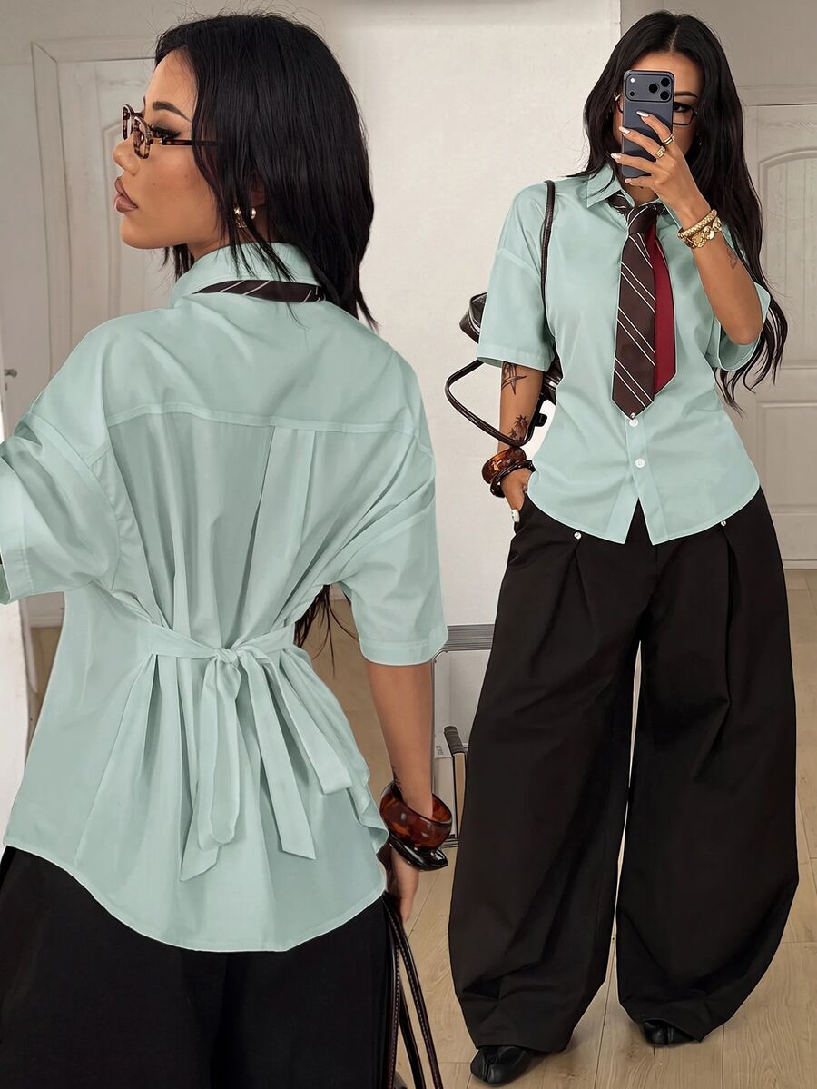 Women's casual button up shirt with half sleeves, classic shirt collar, and chest pocket in a woven fabric.