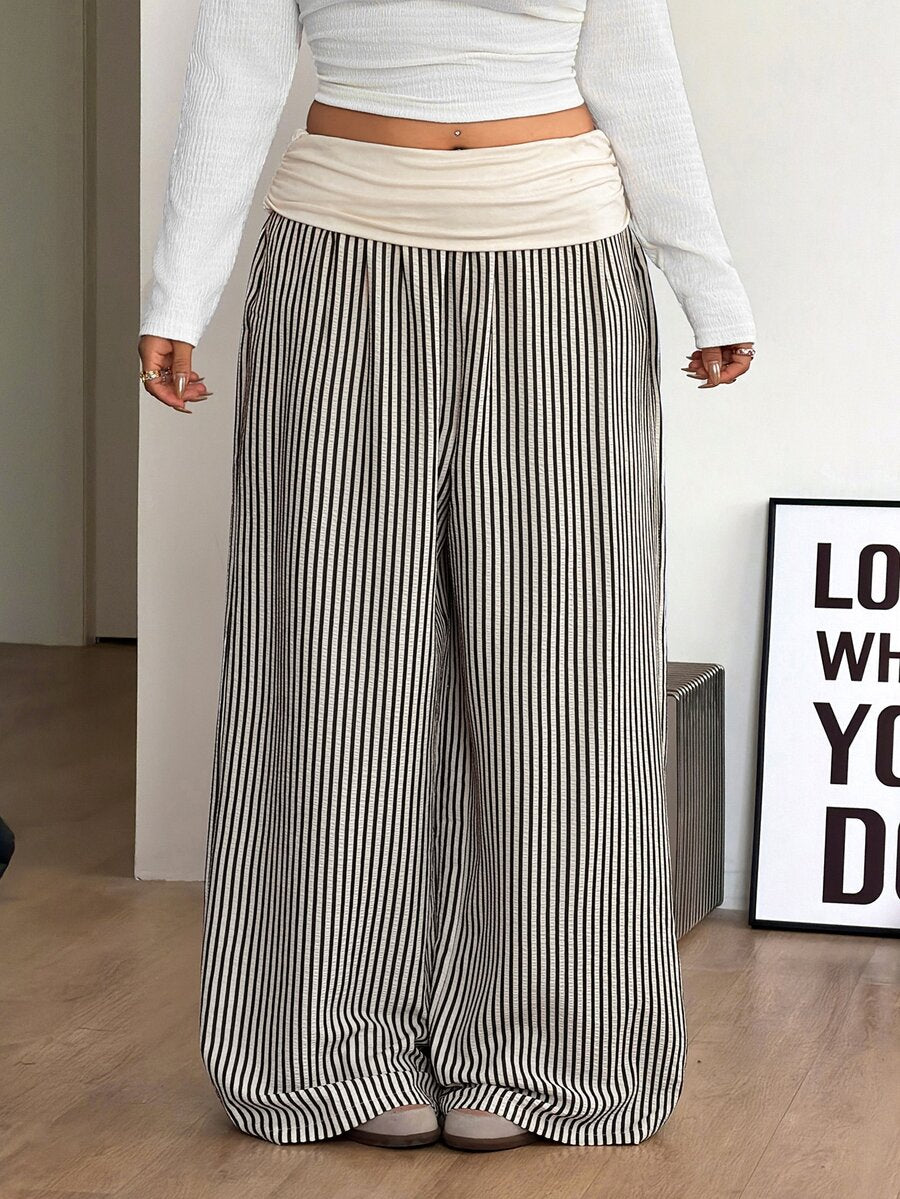 Women's plus size wide leg cotton pants featuring a relaxed loose fit and high waist design.