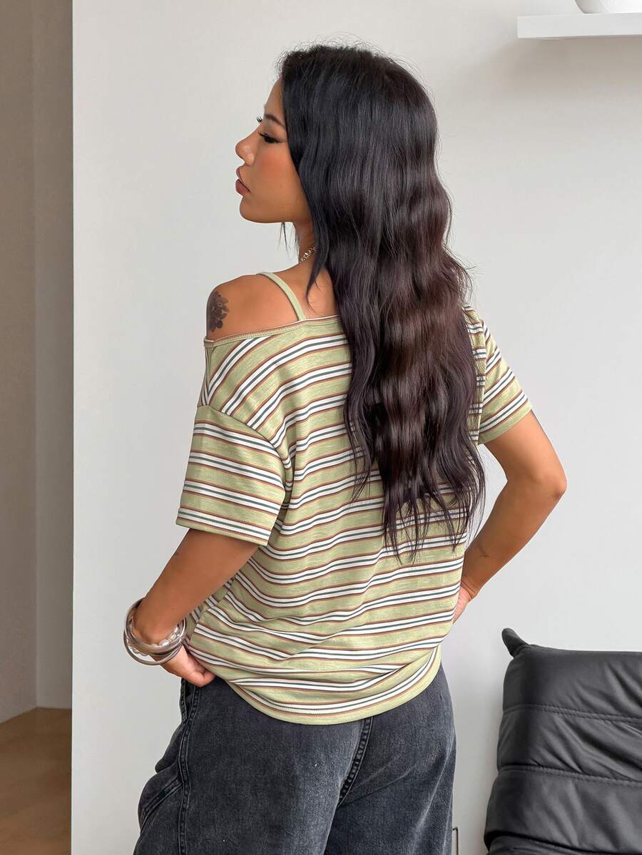 Women's casual loose fit cold shoulder cotton t-shirt with asymmetrical cutout neckline and short sleeves.