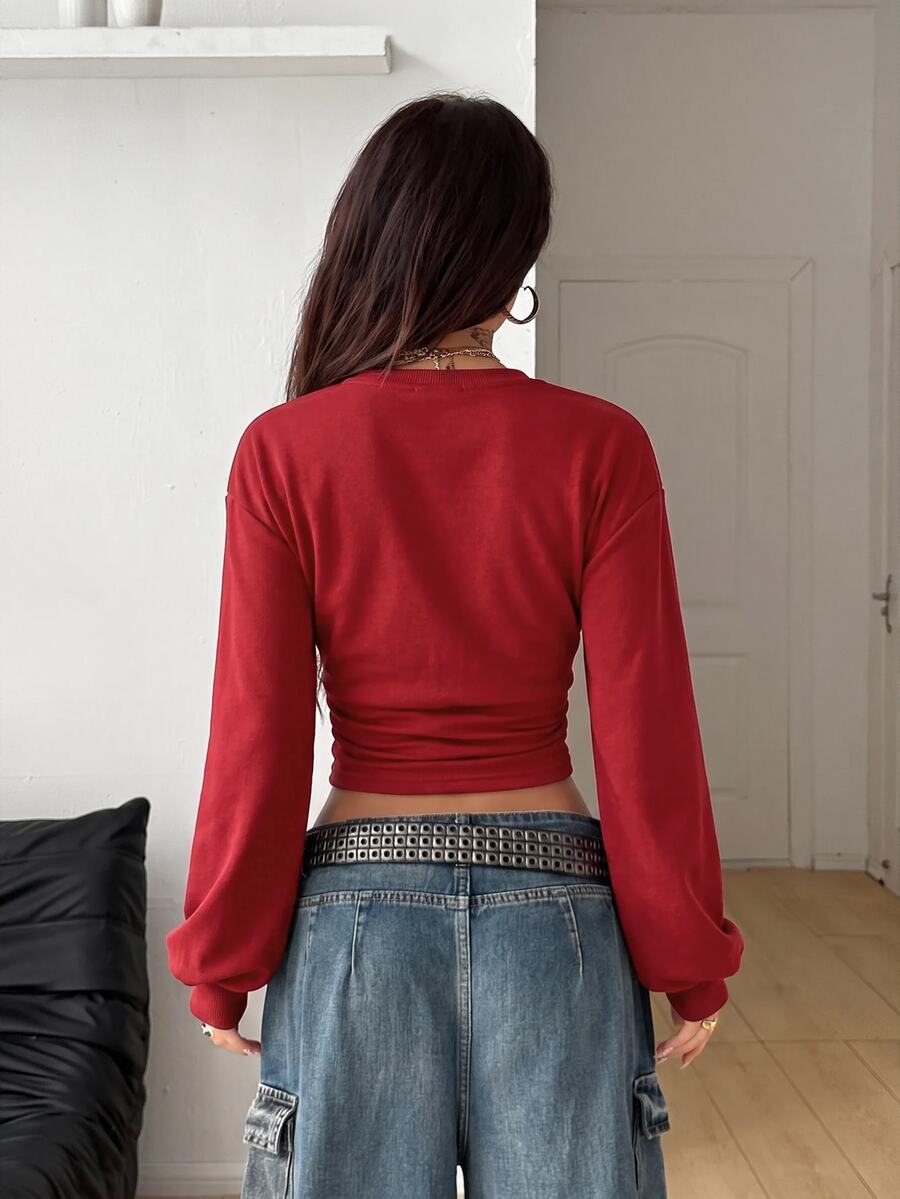 Women's brown waist-cinching sweatshirt featuring a round neck, drop shoulder long sleeves, and rib-knit cuffs.