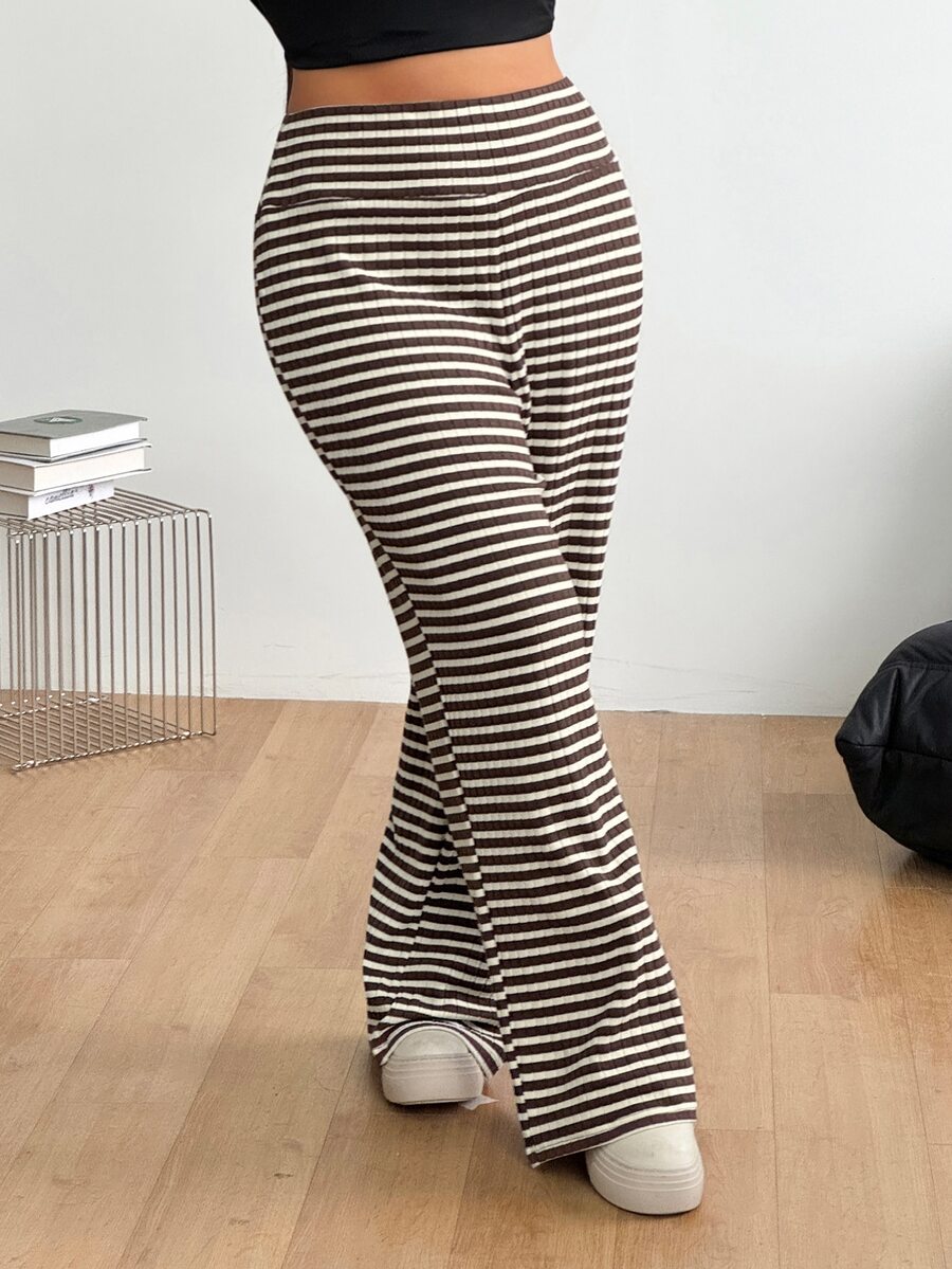 Women's casual straight leg sweatpants featuring a black and white polka dot design with an elastic waistband.