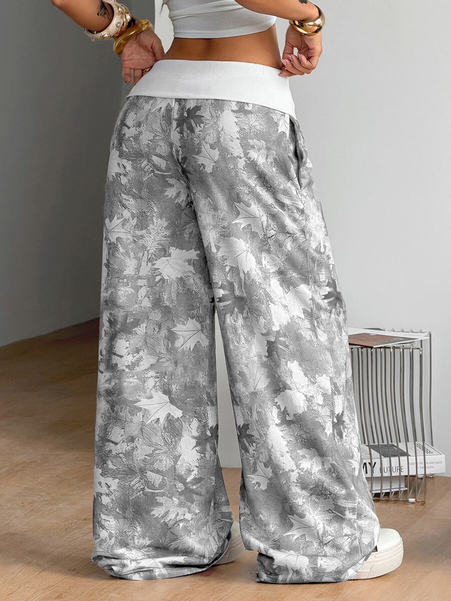 Women's wide leg trousers with a tree branch graphic pattern, loose fit, and mid-rise waist in woven fabric.