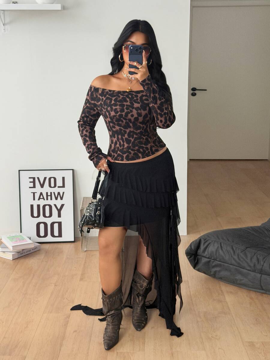 Women's striped off the shoulder long-sleeve top with contrast lace trim and ribbed knit texture.