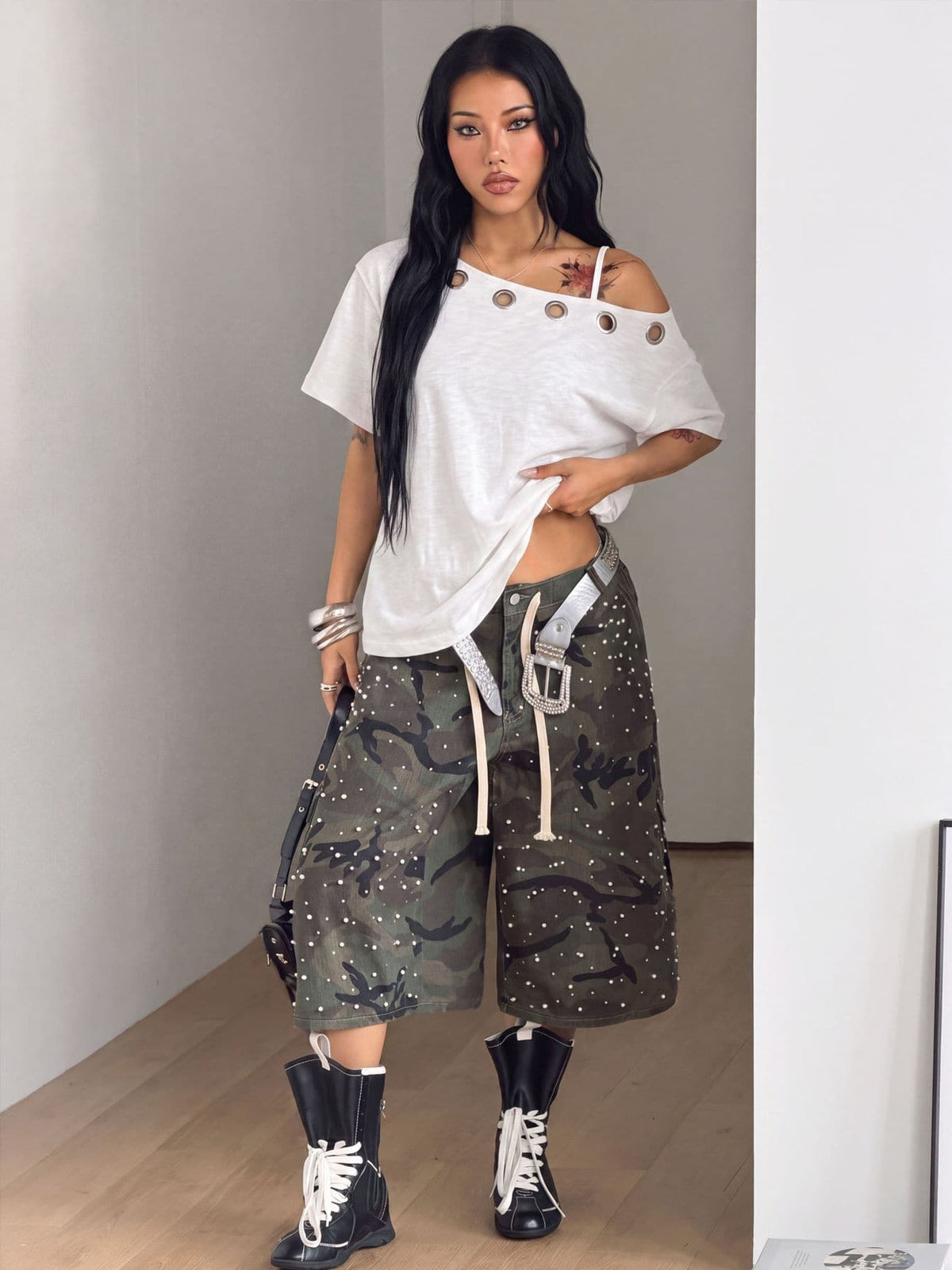 Women's casual loose fit cold shoulder cotton t-shirt with asymmetrical cutout neckline and short sleeves.