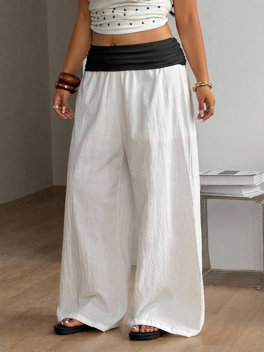 Women's plus size wide leg cotton pants featuring a relaxed loose fit and high waist design.