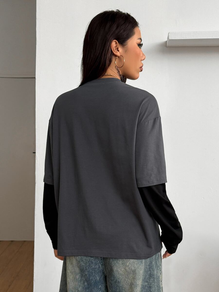 Women's casual graphic long sleeve t-shirt with a round neck, drop shoulder sleeves, and loose relaxed fit.
