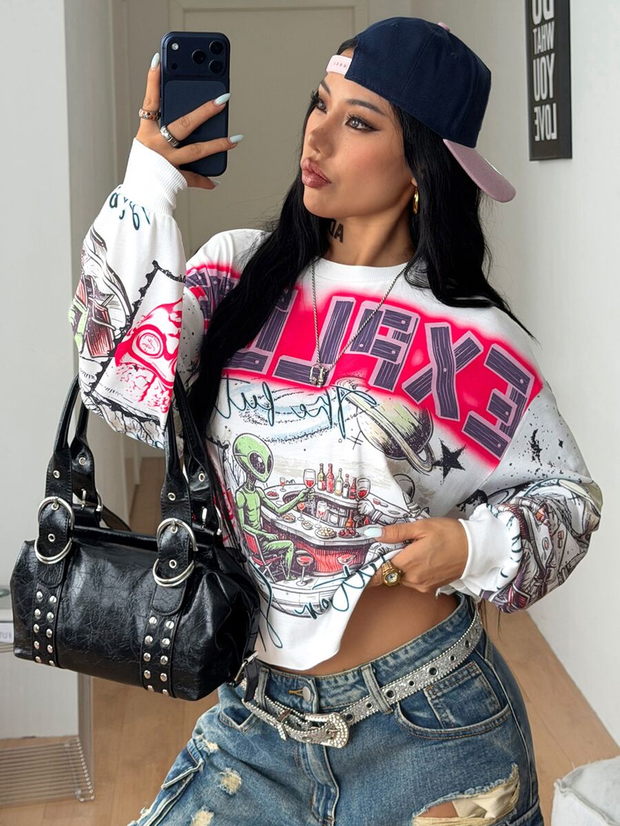 Women's white oversized long sleeve graphic T-shirt with drop shoulders and a round neckline.