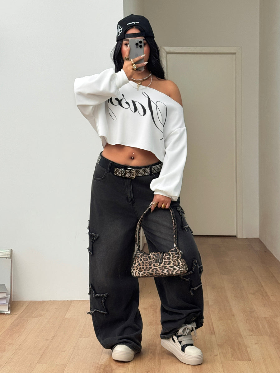 Plus size women's cropped leopard print sweatshirt featuring an asymmetrical neckline and long drop-shoulder sleeves.