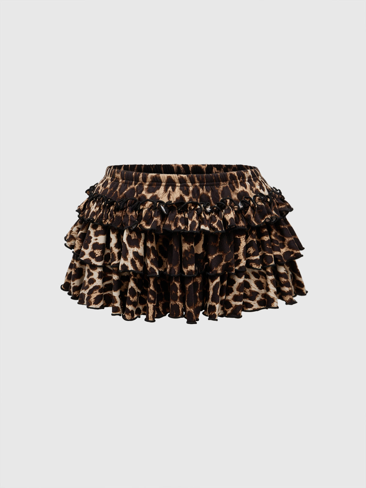 Women's low waist tiered mini skirt featuring ruffled hem layers in knitted stretch fabric.
