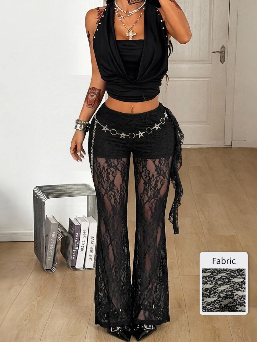 Women's black and white polka dot flare leg pants with side drawstring and ruched details