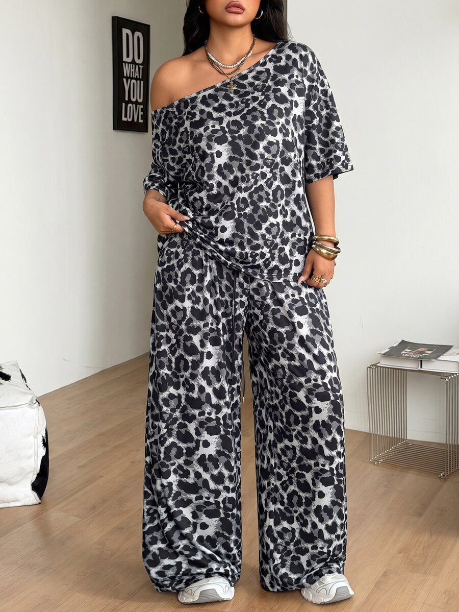 Women's two-piece lounge set featuring a loose drop shoulder asymmetrical neck short sleeve t-shirt and wide-leg knit pants with pockets.