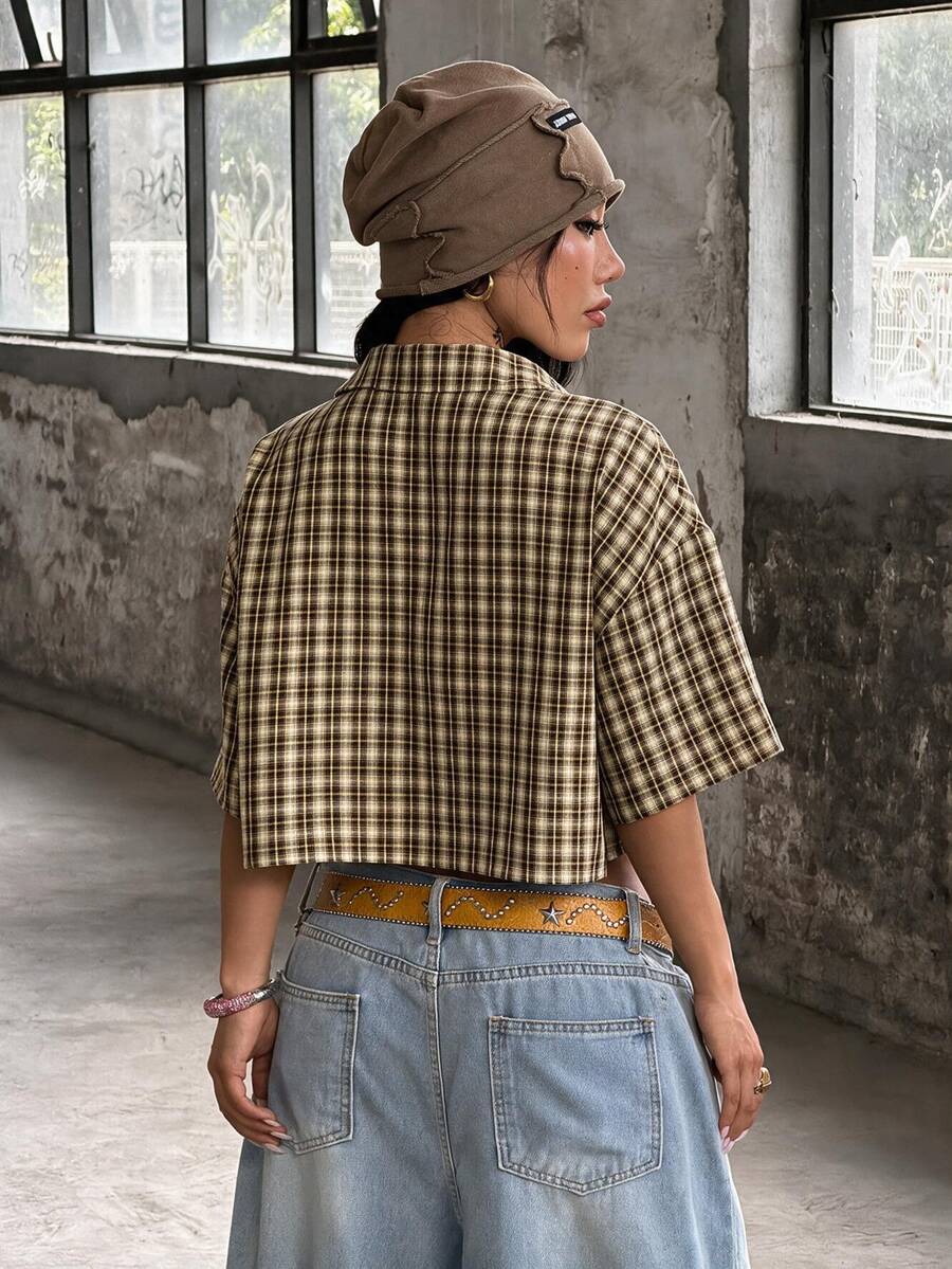 Women's plaid crop shirt with button front, chest pocket, short sleeves, and loose casual fit.